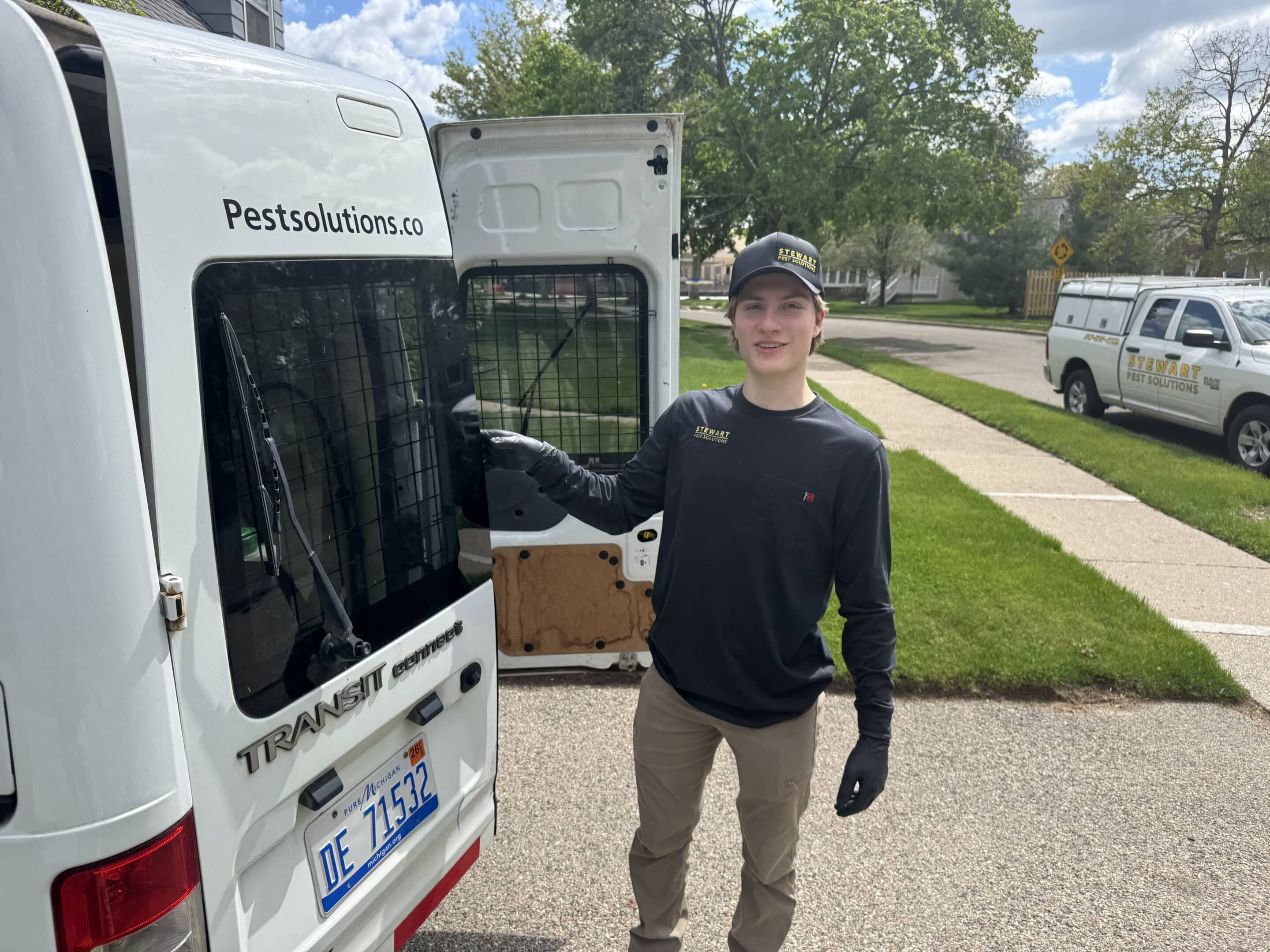 pest control expert standing by van